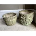 Two concrete planters, one moulded as a coopered barrel, the other with stylised flowers, 26cm