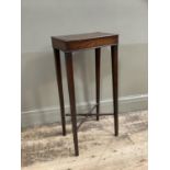 An early 19th century mahogany table, rectangular, on square tapered legs joined by stretchers
