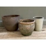Three various garden planters, a large plain terracotta, another with applied scroll work and a