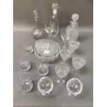 A double lipped cut glass decanter and four matching wine glasses, decanter etched with an 'H',