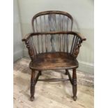 A 19th century ash and elm low back Windsor armchair with pierced splat and railed back, turned