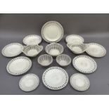 A set of creamware basket weave plates with pierced rims and strapwork baskets