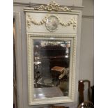 A reproduction French style wall mirror in pale green having a ribboned cresting above a panel inset