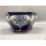 A Royal Doulton Lambeth Stoneware plant holder of hexagonal outline, tube lined and glazed with