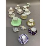 A collection of miniature china cups and saucers with certificates and a cabinet cup and saucer etc