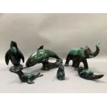 Six Blue Mountain Pottery animal figures of green-black glaze on terracotta body including