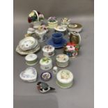 A collection of china flower clusters, trinket boxes, trinket dishes, cabinet cups and saucer etc