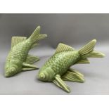 A pair of green glazed pottery fish, impressed mark monogram RP and number 2648/2 nos 52 and 53 of