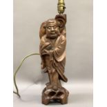 A late 19th century Chinese root carving of a male figure, as a lamp 43cm to the fitting