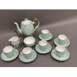 A Queen Anne china coffee service of duck egg blue and gilt star decoration comprising six cups, six