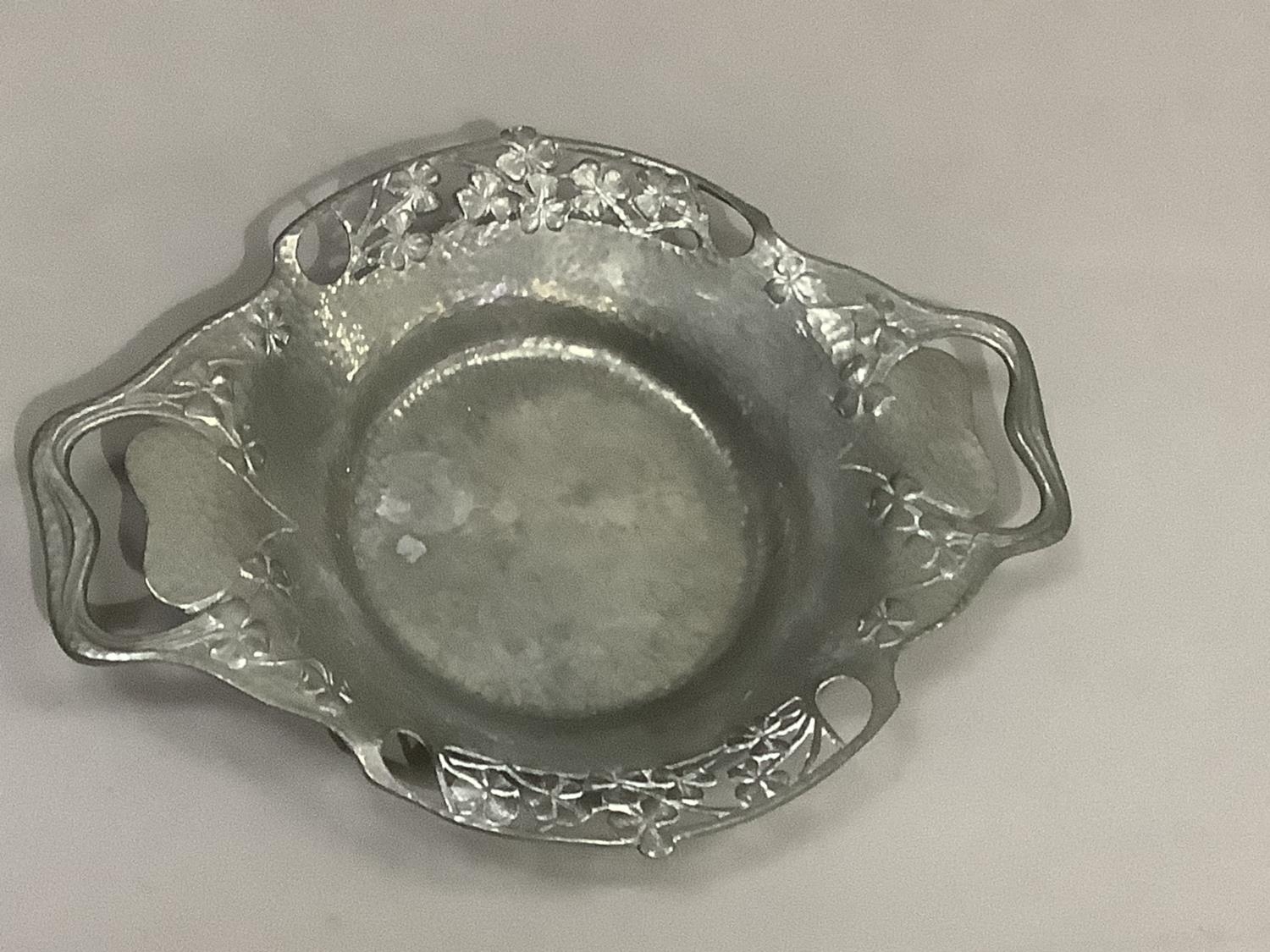 A Tudric pewter two handled dish numbered 0287, the rim pierced with shamrock, 28cm over handles x - Image 2 of 3