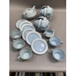 A quantity of Wedgwood Queensware, blue with white sprigged grapevine, teapot, cream jug, thirteen