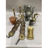 A leather strap with horse brasses, brass snuffer and tray, pewter coffee pot and mugs, pair of