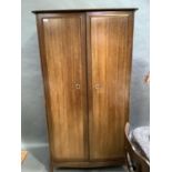 A Stag Minstrel two door wardrobe, 97cm wide by 176cm high