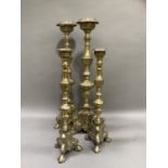 Two pairs of reproduction brass candlesticks of Baroque style in two heights, 61cm and 48cm high