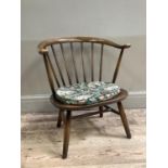 A child's Ercol rail back chair