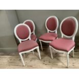 A set of four ivory finished French style salon chairs upholstered in pink fabric to the oval