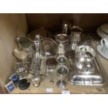 A collection of silver plated ware including oval and rectangular entree dishes and covers, mugs,