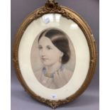 A Victorian head and shoulder portrait of a young woman with her hair swept back, oval, unsigned,
