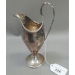 A George III silver cream jug, London 1783, approx. weight 4oz, 6.5cm high