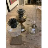 Three various early 20th century oil lamps of various forms