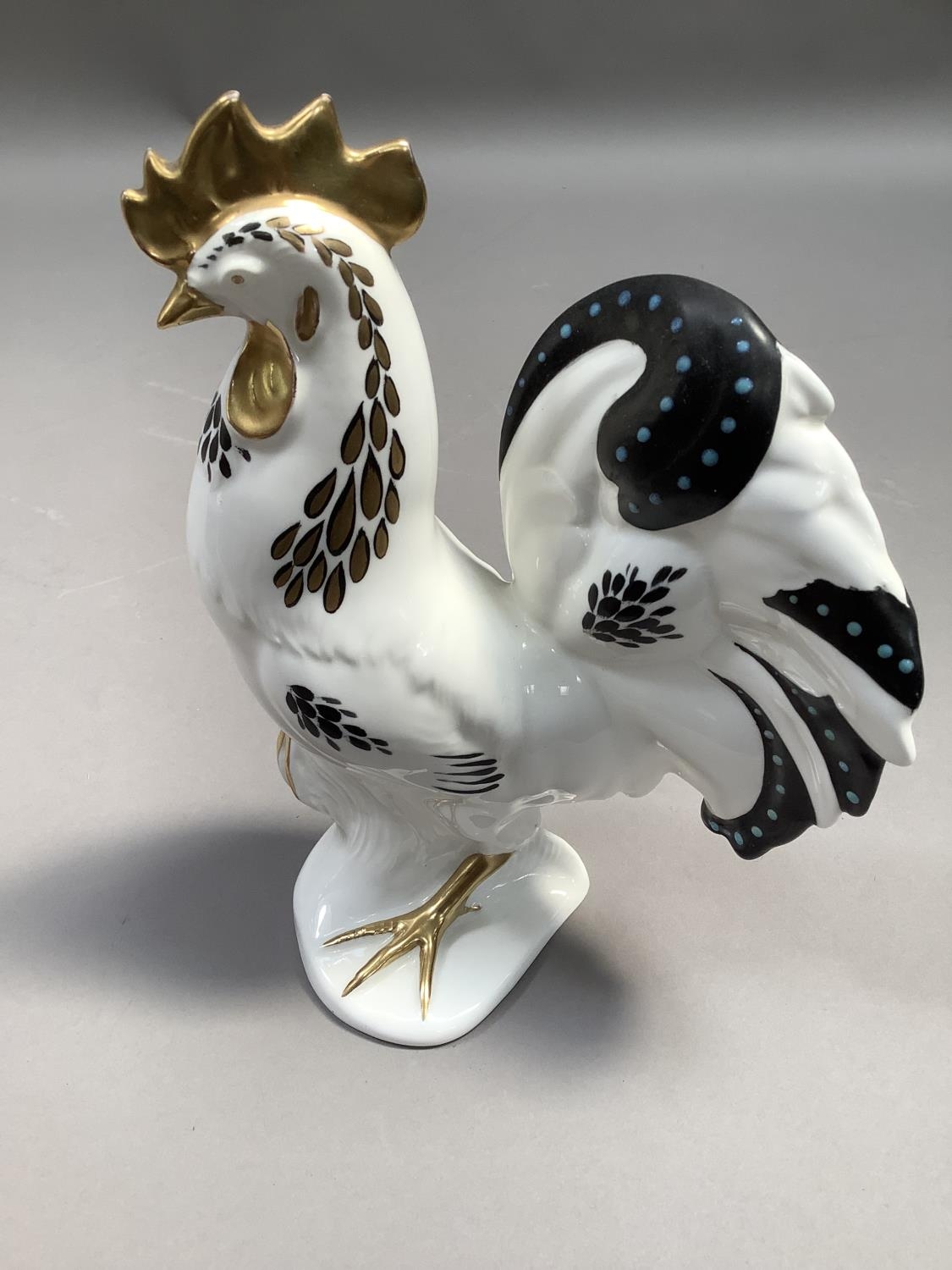A Foley china figure of a cockerel, white ground painted in dark blue gilt and turquoise beading,