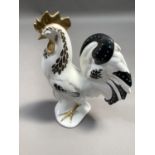 A Foley china figure of a cockerel, white ground painted in dark blue gilt and turquoise beading,