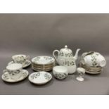 A Crown Staffordshire tea service of Appleblossom design comprising tea pot, sugar bowl and cream