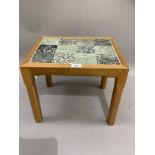 A tulip wood and granite inset occasional table, from Cornwall