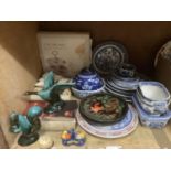 A quantity of blue and white plates mainly willow pattern, prunus blossom ginger jar, sauce tureens,