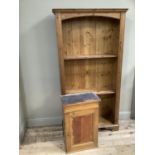 A pine bookcase having five shelves together with a single door pine hanging wall cupboard