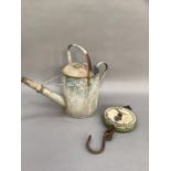 A vintage aluminium watering can marked for 1 1/2 gallons together with a pair of Salter spring