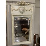 A reproduction French style wall mirror in pale green having a ribboned cresting above a panel inset
