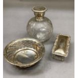 A silver trinket dish of pierced design, Birmingham 1918, silver lidded glass scent bottle,