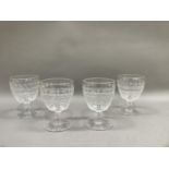 A set of four 19th century wine goblets, the panel cut bodies having a border, fan cut and octagonal