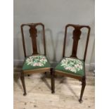 A pair of mahogany single chairs having a vase splat, floral needlework sear and on cabriole legs