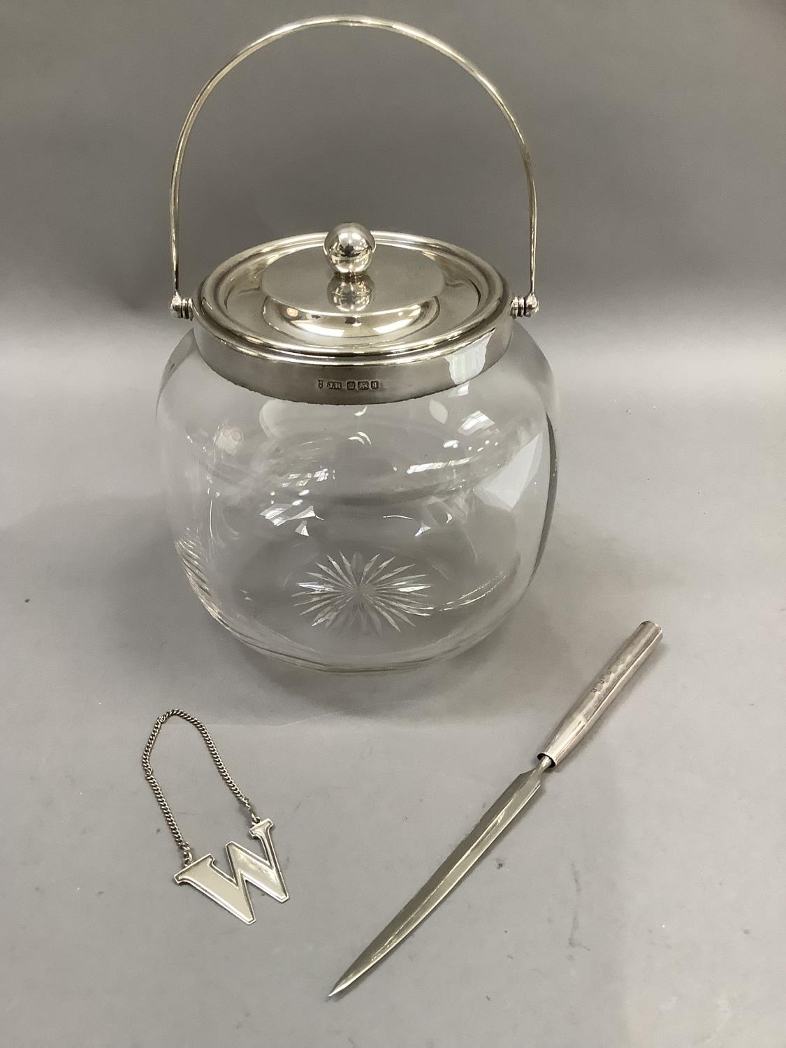 A silver mounted glass biscuit barrel with star cut base, Sheffield 1908 together with a modern