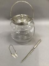 A silver mounted glass biscuit barrel with star cut base, Sheffield 1908 together with a modern