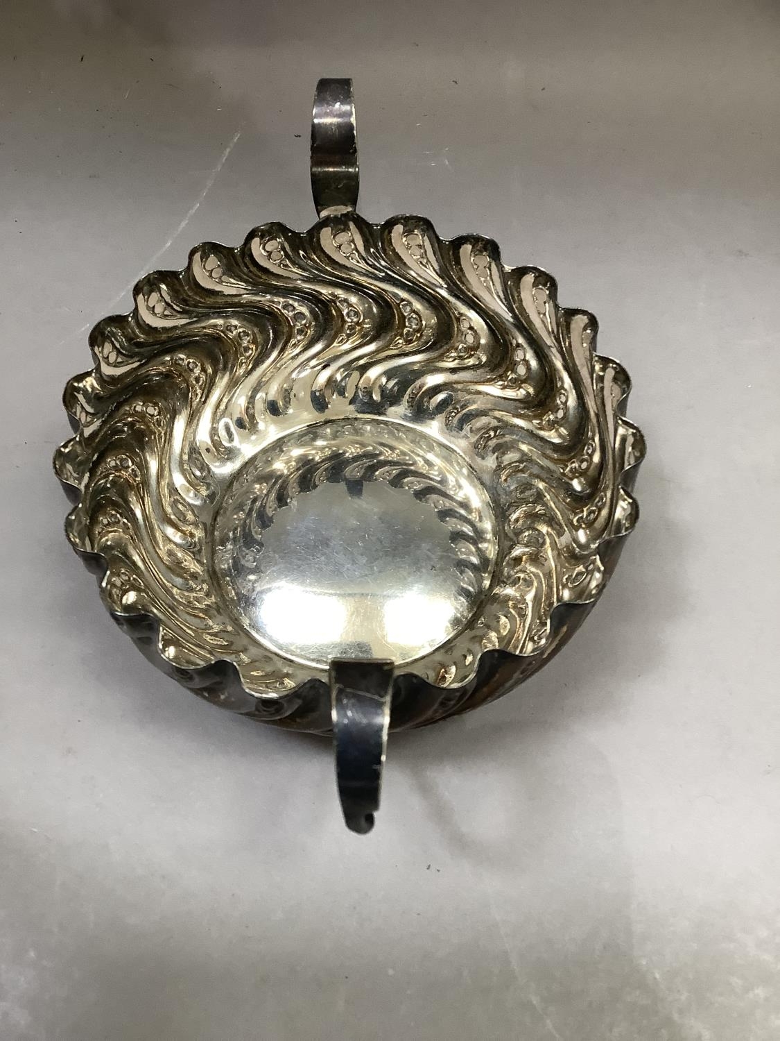 A Victorian silver two handled bon bon dish, circular outline of embossed wrythern stem type - Image 2 of 3