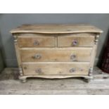 A Victorian pine chest of drawers, the top of serpentine outline above two short and two long