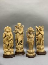 Four Indian carved balsa wood figures of Shiva and three other Indian deities, measuring