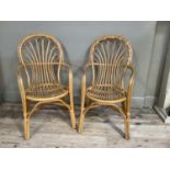 A pair of bamboo and cane open armchairs