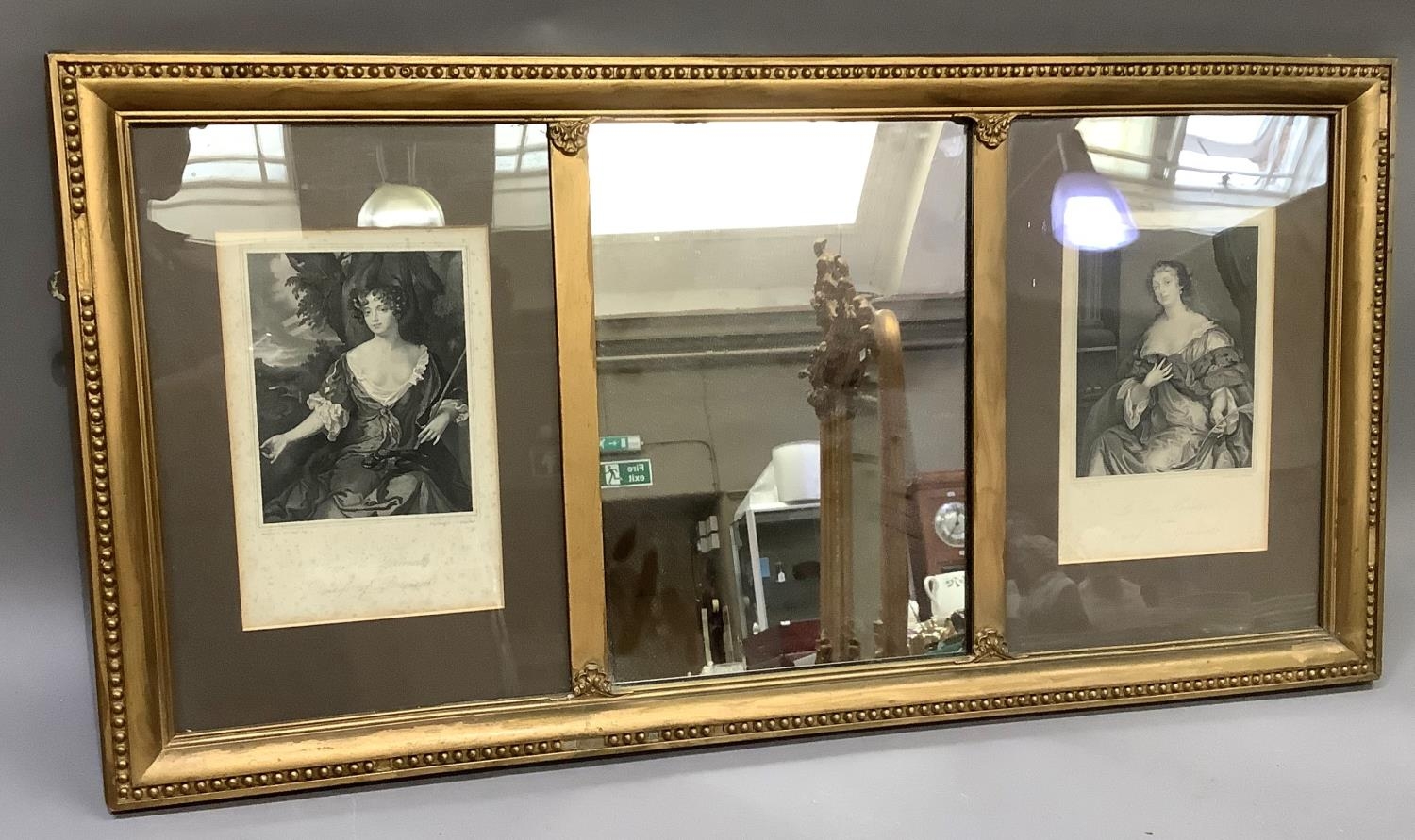 A gilt framed over mantel mirror having a rectangular glass flanked by inset engravings after Sir