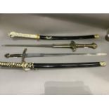 Four reproduction swords including two of Japanese influence both with white composite handles and