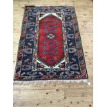 A Turkish village rug, 182cm x 125cm