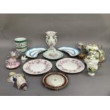 A Victorian tea set of teapot, sugar bowl and cover, cream jug, two cups and saucers (faults) , a