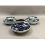 A Chinese export blue and white cup and saucer painted with the willow pattern with gilt