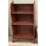 A set of mahogany finish waterfall bookshelves with drawer to base on bracket feet, 69cm wide