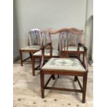 A set of 19th century mahogany dining chairs with serpentine top rail, pierced splat and floral