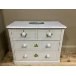 A Victorian pine chest of drawers painted in pale grey with lavender, snow drops and other